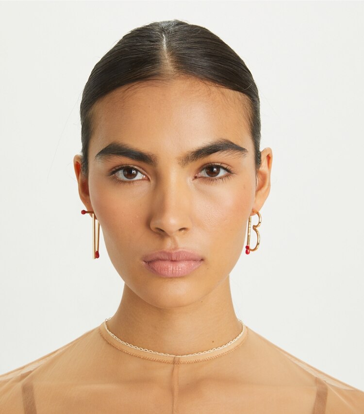 Tory Burch designer earrings TB Matchstick Earring in Tory Gold / Red accessory on model