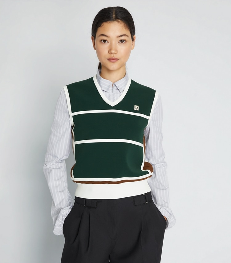 Tory Sport designer sweaters Tech Nylon Sweater Vest in Conifer on model detail
