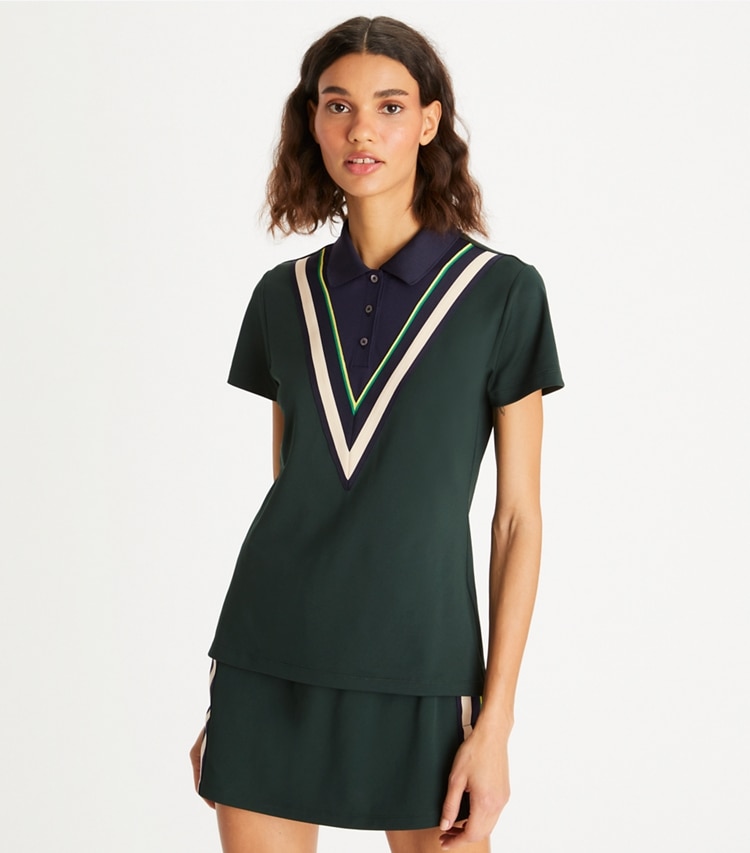 Tory Sport designer tops Tech Piqué Chevron Polo in Conifer on model detail