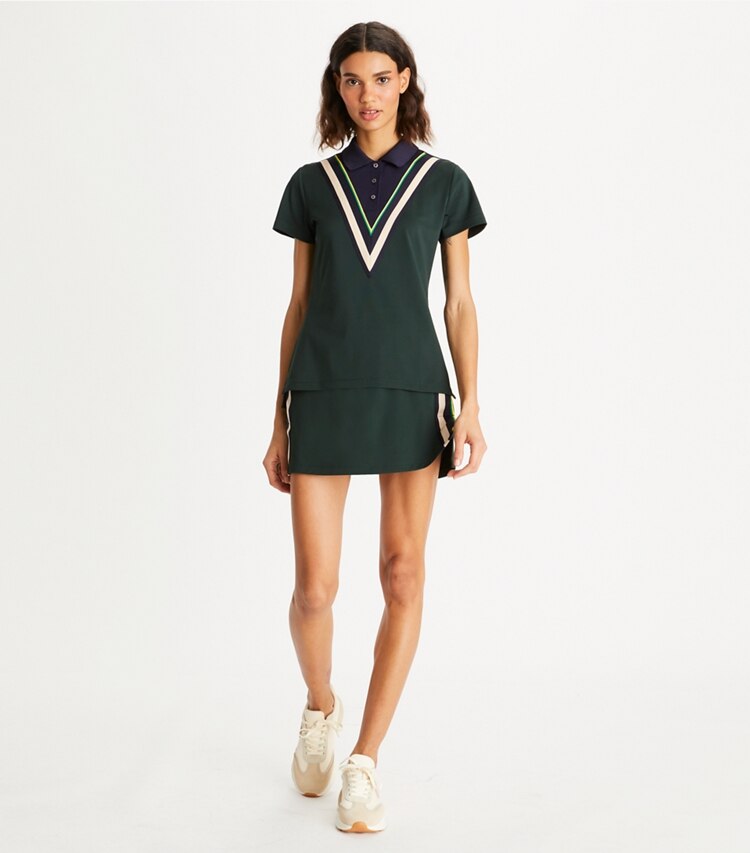 Tory Sport designer tops Tech Piqué Chevron Polo in Conifer on model front