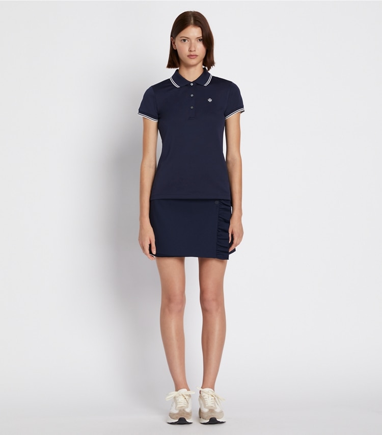 Tory Sport designer tops Tech Piqué Polo in Tory Navy on model front