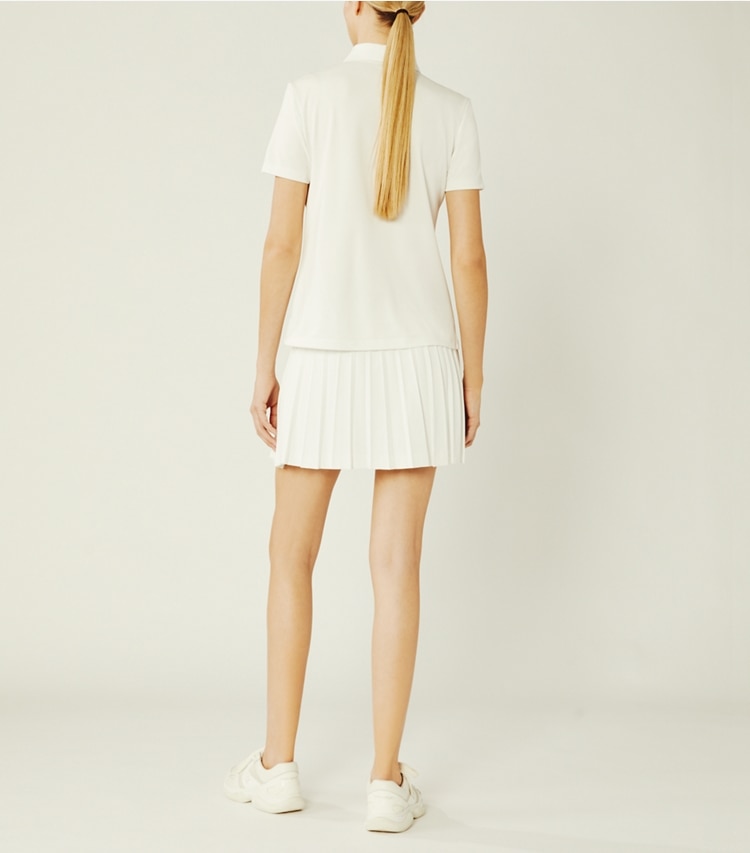 Tory Sport designer tops Tech Piqué Ruffle Polo in Snow White on model back