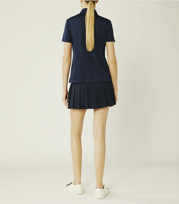 Tory Sport designer tops Tech Piqué Ruffle Polo in Tory Navy on model back