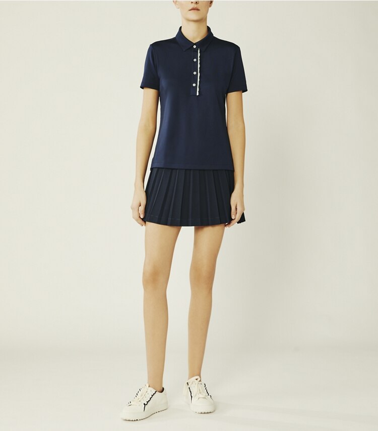 Tory Sport designer tops Tech Piqué Ruffle Polo in Tory Navy on model front