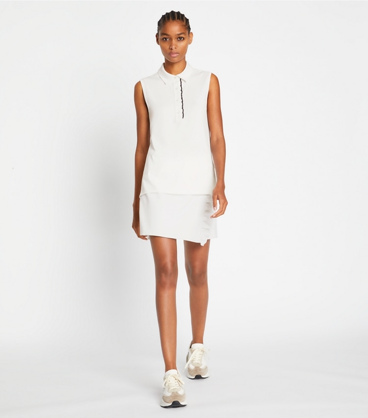 Tory Sport designer tops Tech Piqué Sleeveless Ruffle Polo in Snow White on model front