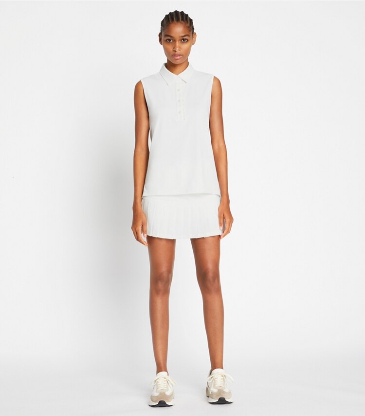 Tory Sport designer tops Tech Piqué Sleeveless Ruffle Polo in Snow White / Snow White on model front