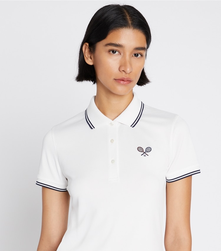 Tory Burch designer tops Tech Piqué Tennis Polo in Snow White / Tory Navy on model detail