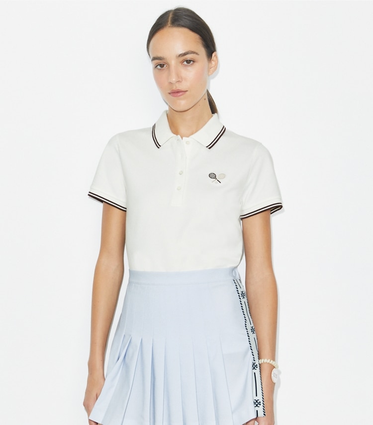 Tory Burch designer tops Tech Piqué Tennis Polo in Snow White / Dark Sangria on model detail