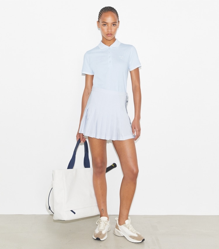 Tory Burch designer tops Tech Piqué Tennis Polo in Light Blue  / Snow White on model front