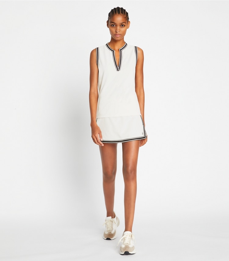 Tory Sport designer bottoms Tech Piqué Tennis Skirt in Snow White on model front