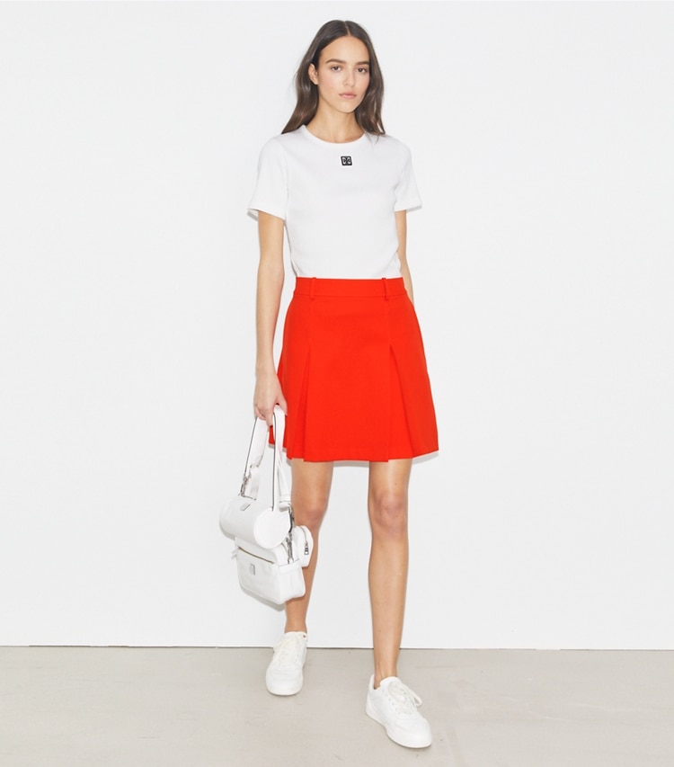 Tory Burch designer bottoms Tech Twill Golf Skirt in Blazing Red on model front