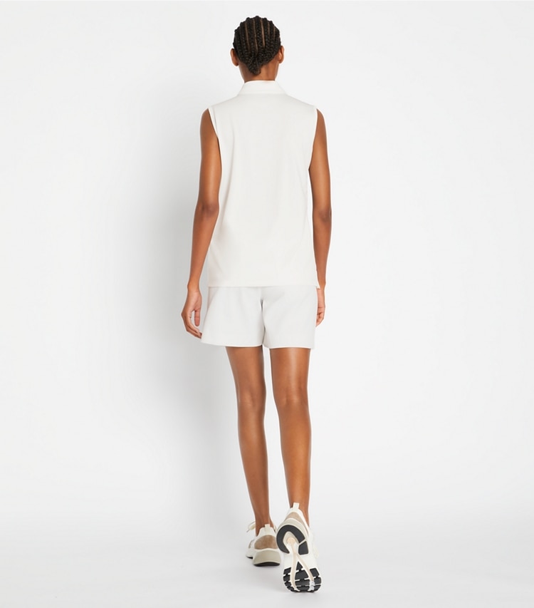 Tory Sport designer bottoms Tech Twill Golf Skort in Snow White on model back