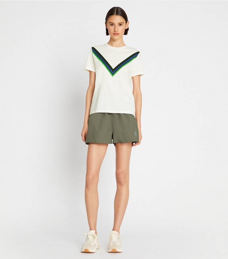 Tory Sport designer tops Tempo Chevron T-Shirt in Snow White / Conifer on model front