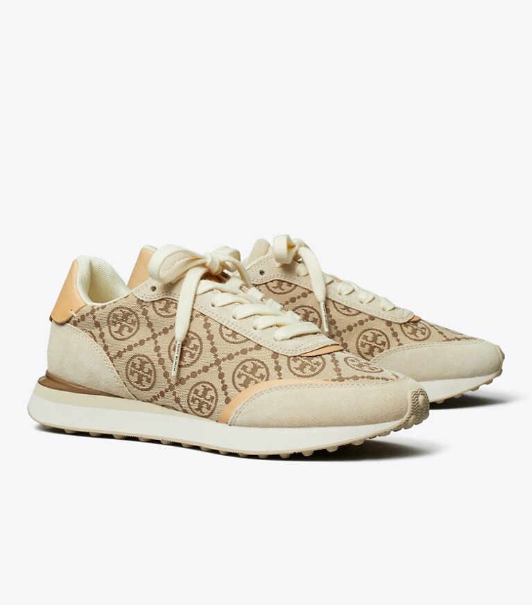Tory Burch diseñador zapatillas Tenis Destiny con monograma de T en HAZEL / RIVER ROCK ángulo