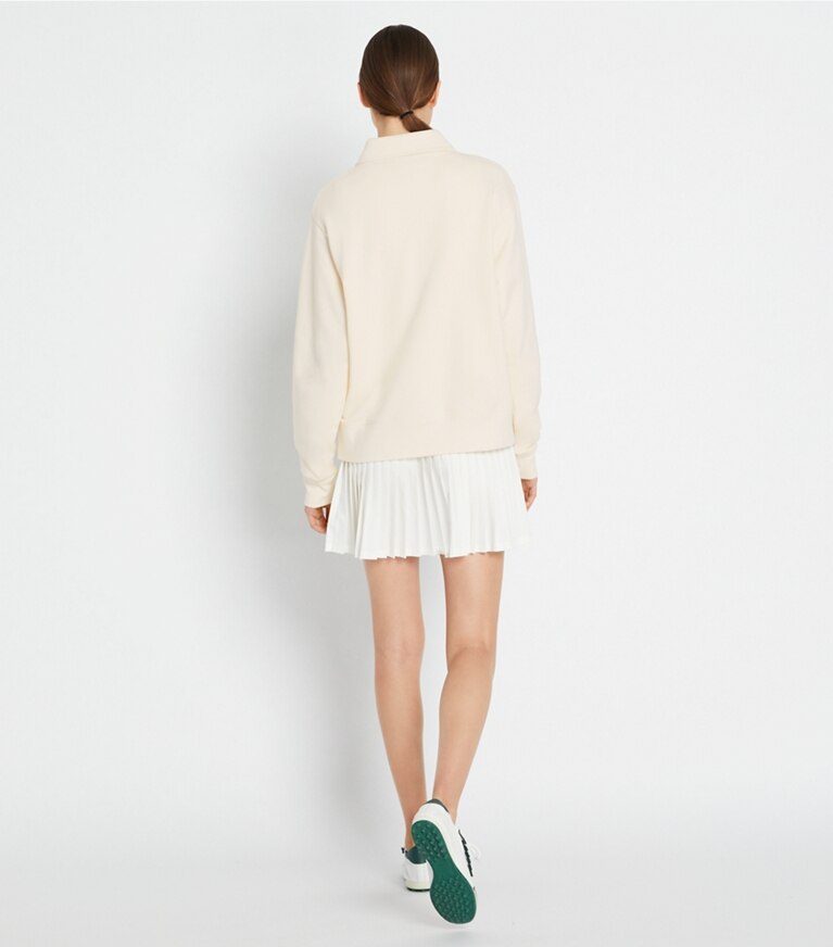 Tory Sport designer oberteile Tennispullover aus schwerem French Terry mit halbem Reißverschluss in Ivory Pearl / Tory Navy front