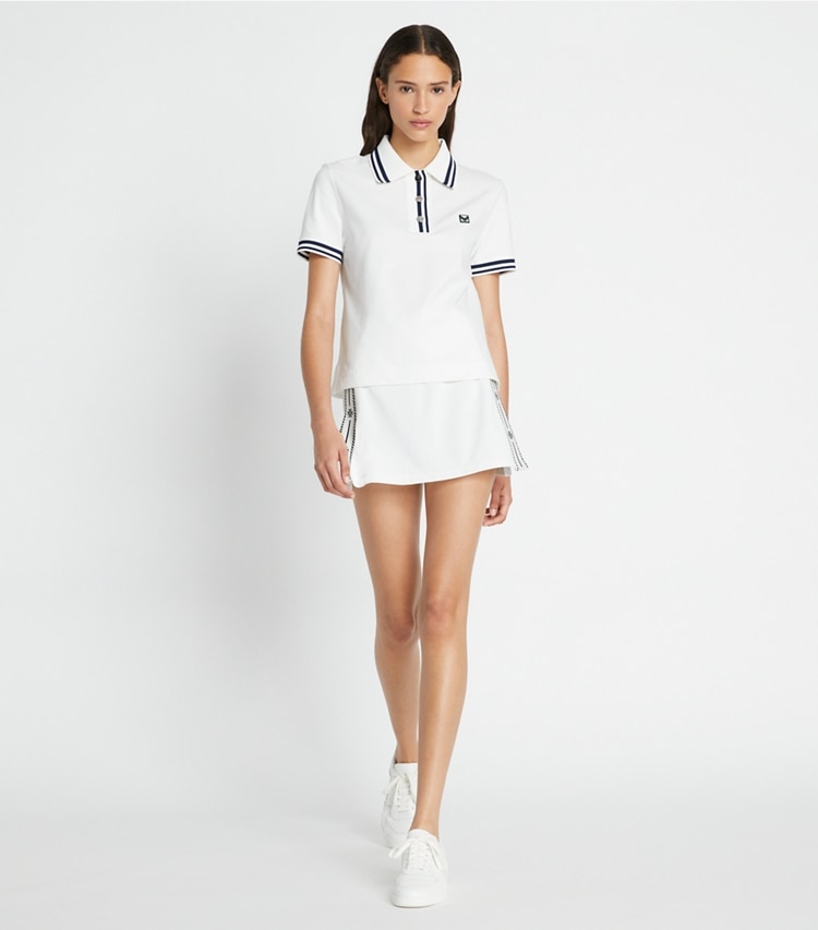 Tory Sport designer unterteile Tennisrock aus Funktions-Piqué mit Seitenschlitz in Snow White modell von vorn