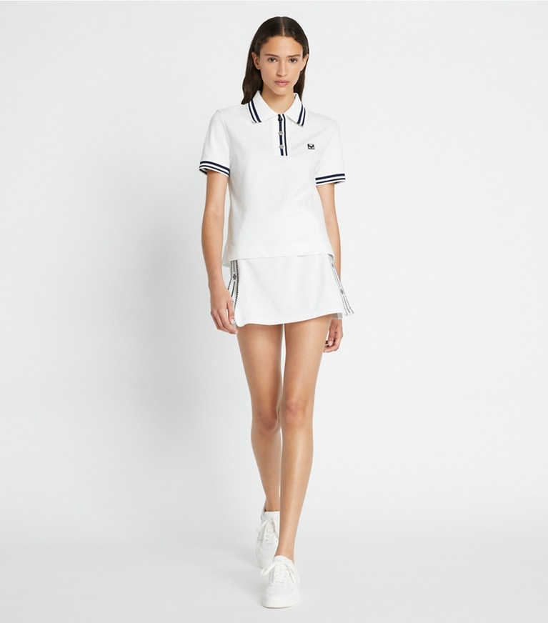 Tory Sport designer unterteile Tennisrock aus Funktions-Piqué mit Seitenschlitz in Snow White front