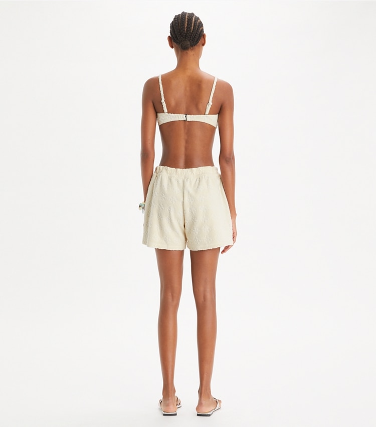 Tory Burch designer カバーアップ テリージャカード ロゴ ショーツ in NEW IVORY on model back