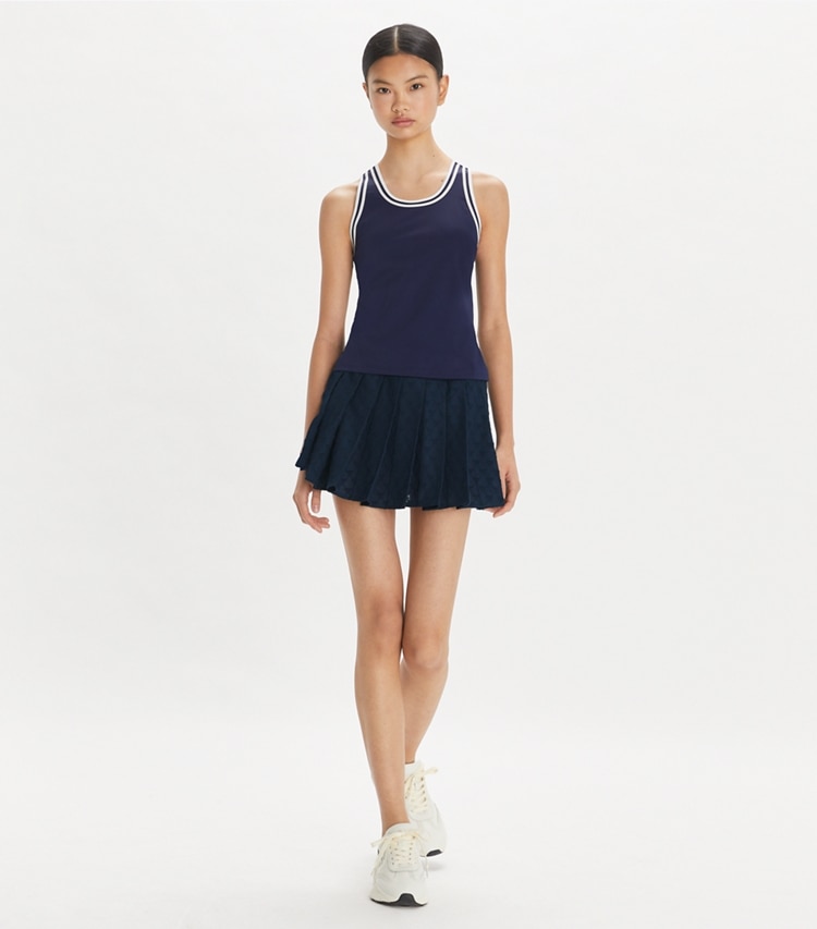 Tory Sport designer bottoms Terry Jacquard Mini Tennis Skirt in Tory Navy on model front
