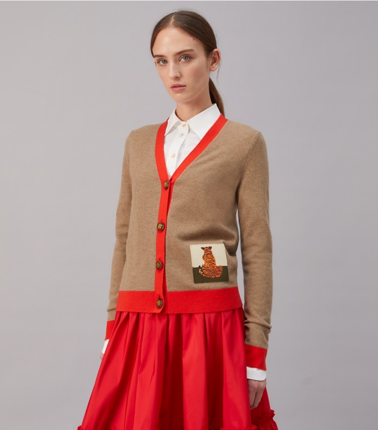 Tory Burch designer sweaters Tiger Patch Cashmere Cardigan in RICH TAUPE / BRILLIANT RED on model detail