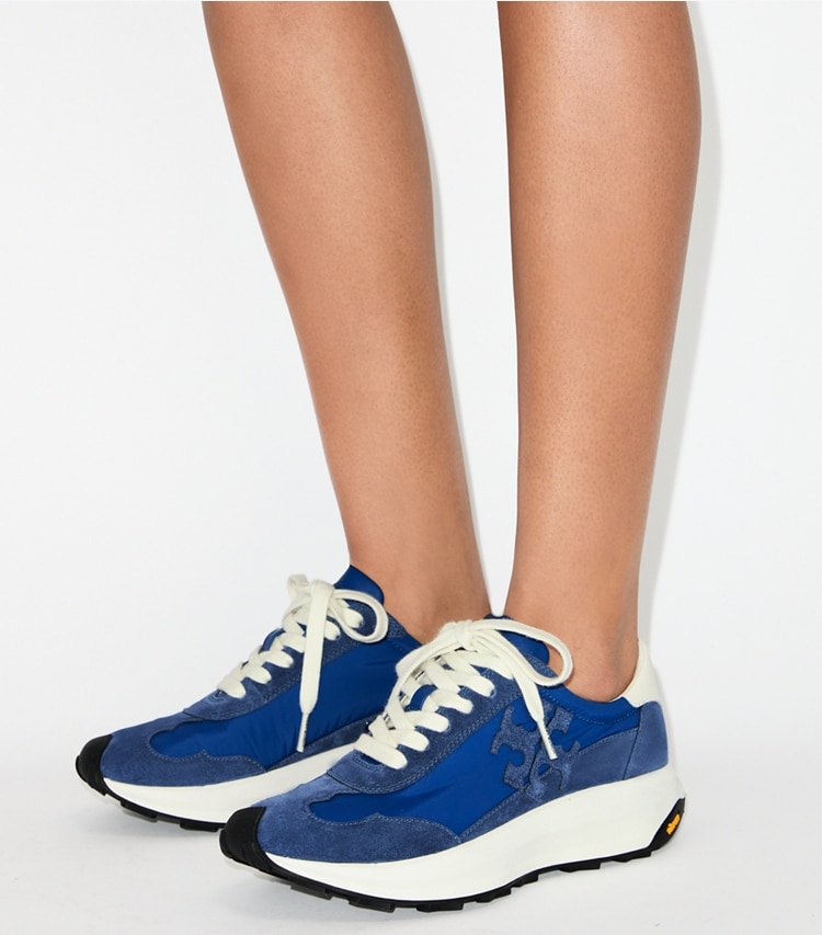 Tory Burch designer sneakers Tory Sneaker in AZURE / FADED NAVY / CREAM accessory on model