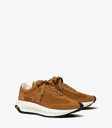 Tory Burch designer sneakers Tory Trainer in COGNAC BROWN angle