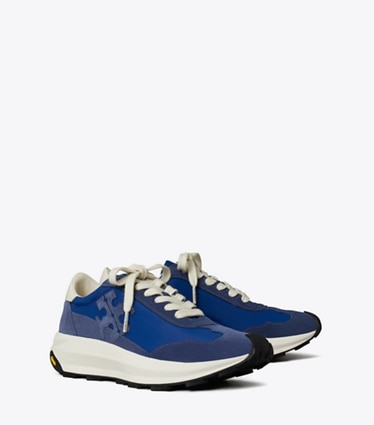 Tory Burch designer sneakers Tory Trainer in AZURE / FADED NAVY / CREAM angle