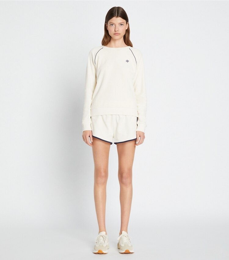 Tory Sport designer bottoms Towel Terry Short in Ivory Pearl on model front