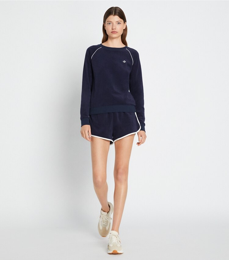 Tory Sport designer bottoms Towel Terry Short in Tory Navy on model front
