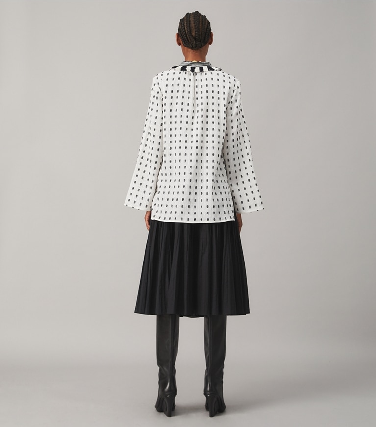 Tory Burch designer tops Tunic with Sweater Tassels in WHITE / NAVY front