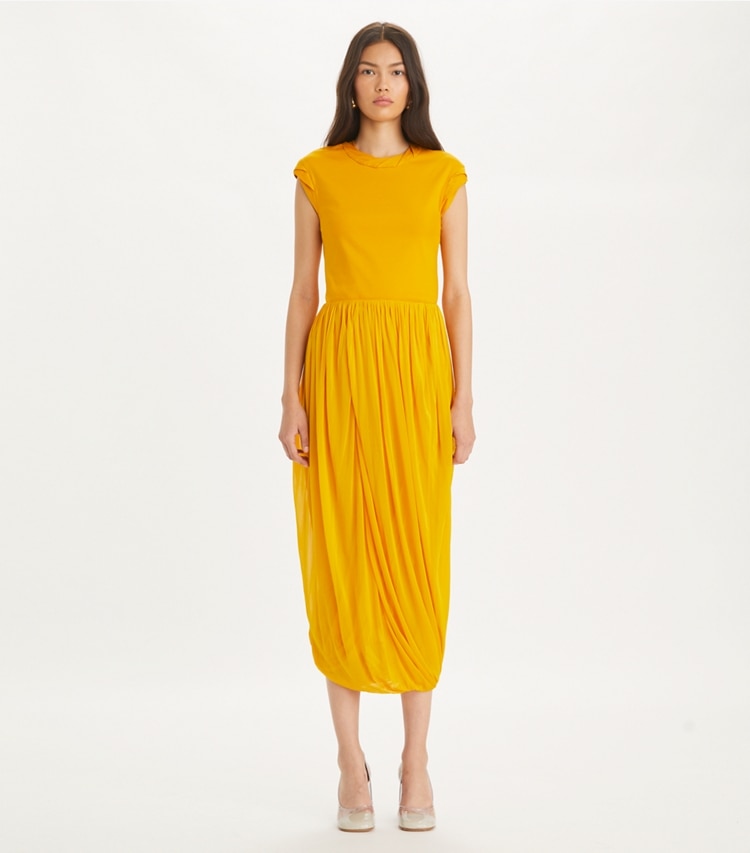Tory Burch designer tops Twisted Knit Top in Sun on model front