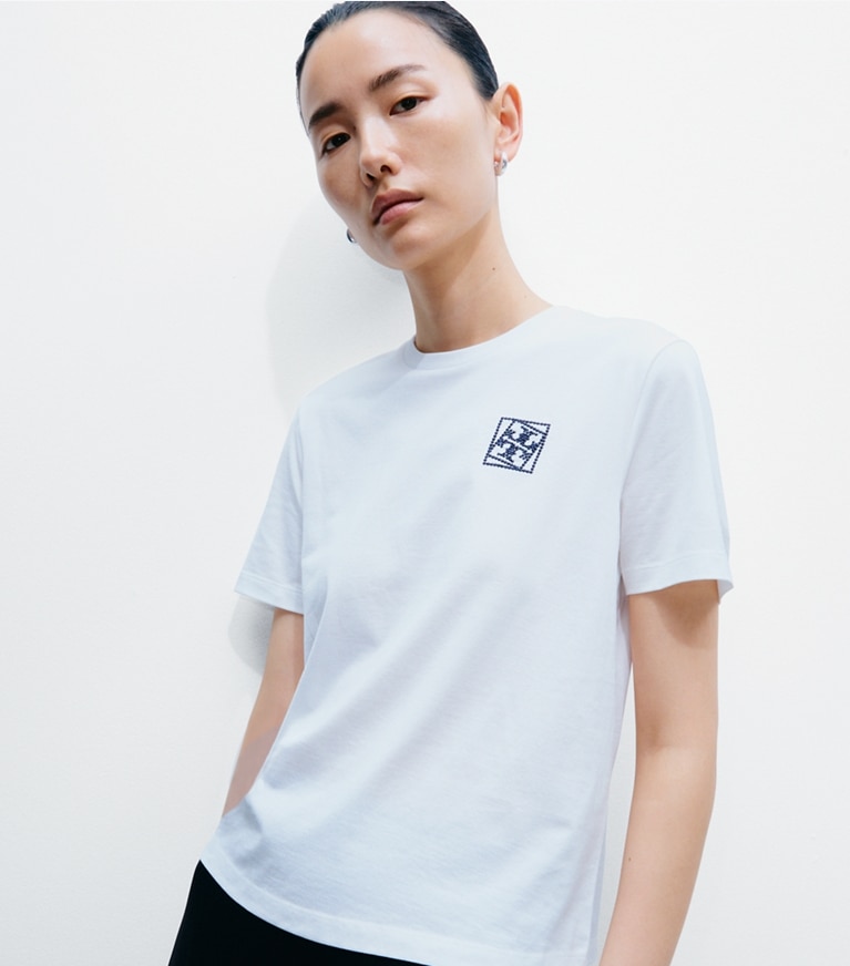 Tory Burch designer tops Twisted Logo T-Shirt in Snow White on model detail