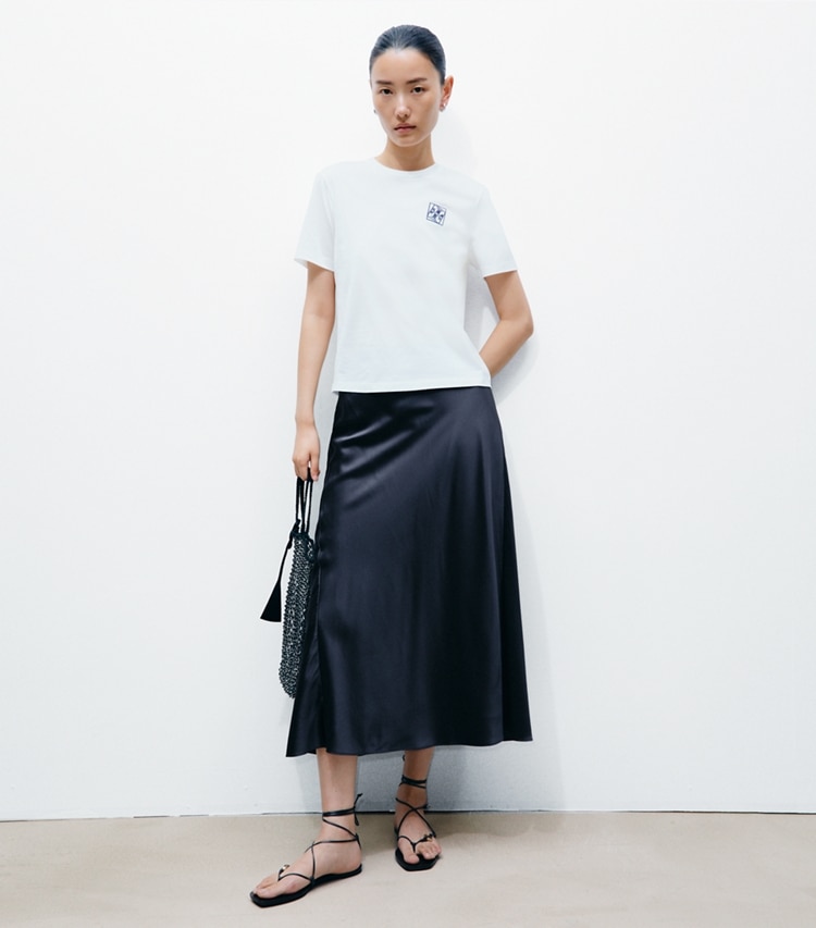 Tory Burch designer tops Twisted Logo T-Shirt in Snow White on model front
