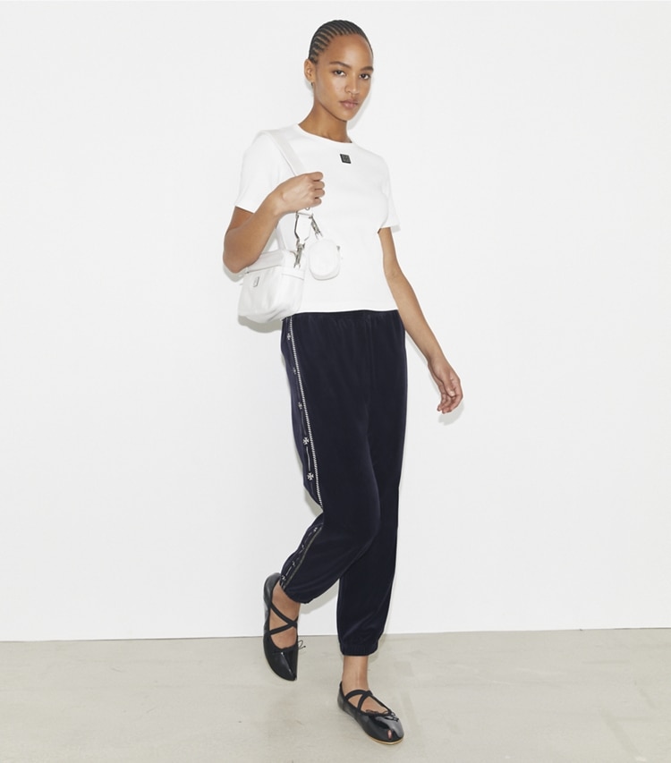 Tory Burch designer bottoms Velour Logo Jogger in Medium Navy on model front