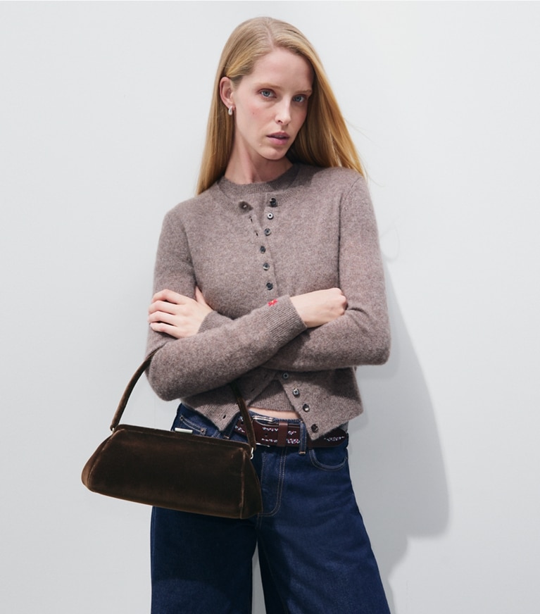 Tory Burch designer clutches Velvet Frame Clutch in Chestnut accessory on model