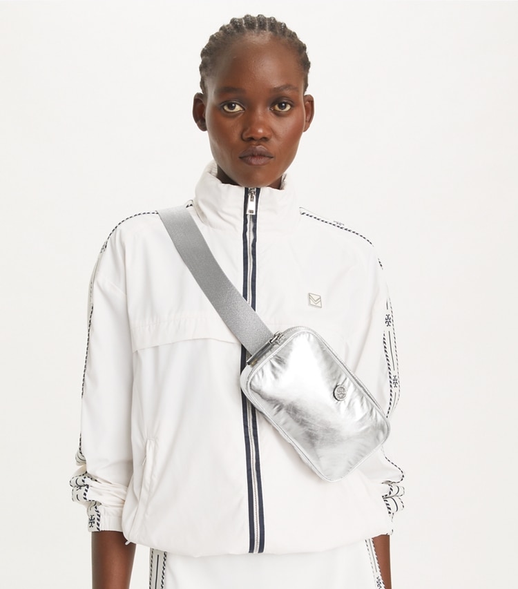 Tory Burch designer belt bags Virginia Metallic Belt Bag in Silver accessory on model