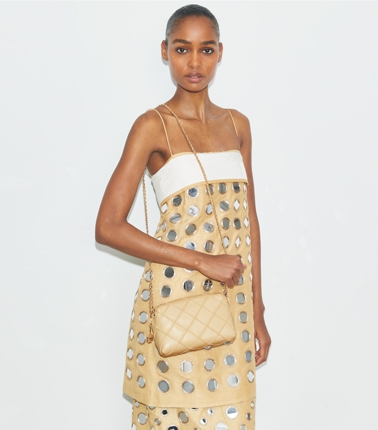 Tory Burch designer crossbody bags Weiche Fleming Crossbody Bag in Vanilla Soft Serve accessory on model