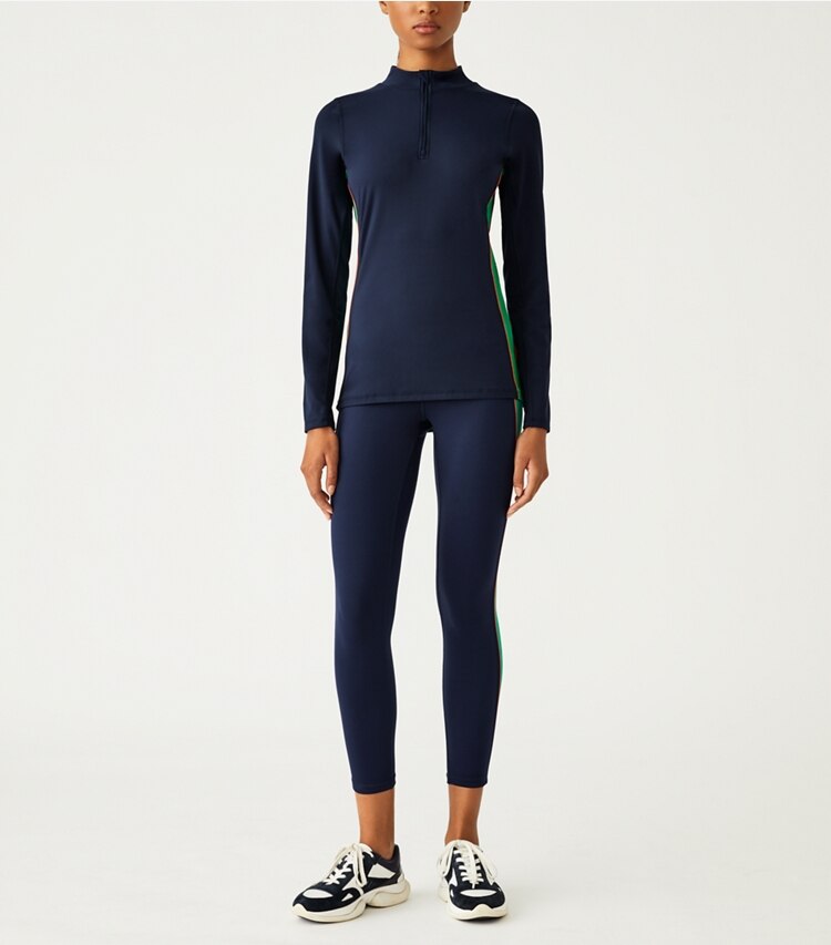 Tory Sport designer tops Weightless Contrast-Piped Half-Zip Pullover in Tory Navy / Vineyard on model front