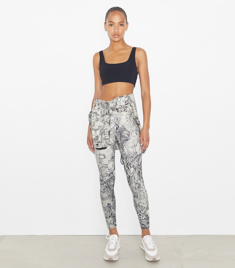 Tory Sport designer bottoms Weightless Printed 7/8 Legging in Grey Alien Toile on model front
