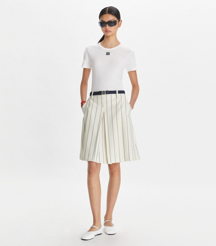 Tory Sport designer bottoms Wool Performance Golf Skirt in New Ivory Light Stripe on model front