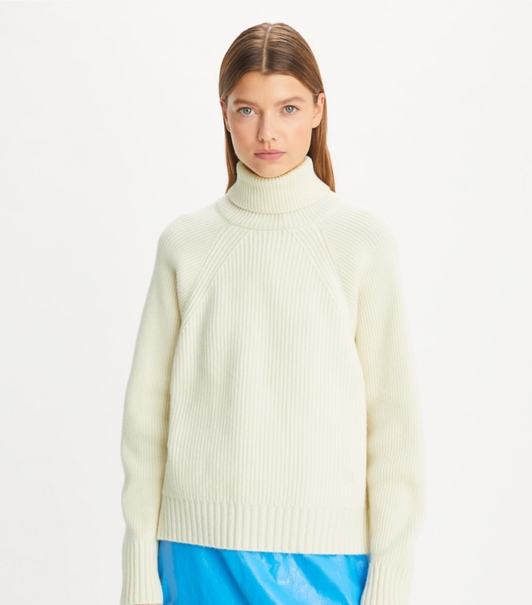 Tory Sport designer sweaters Wool Turtleneck Sweater in NEW IVORY on model detail