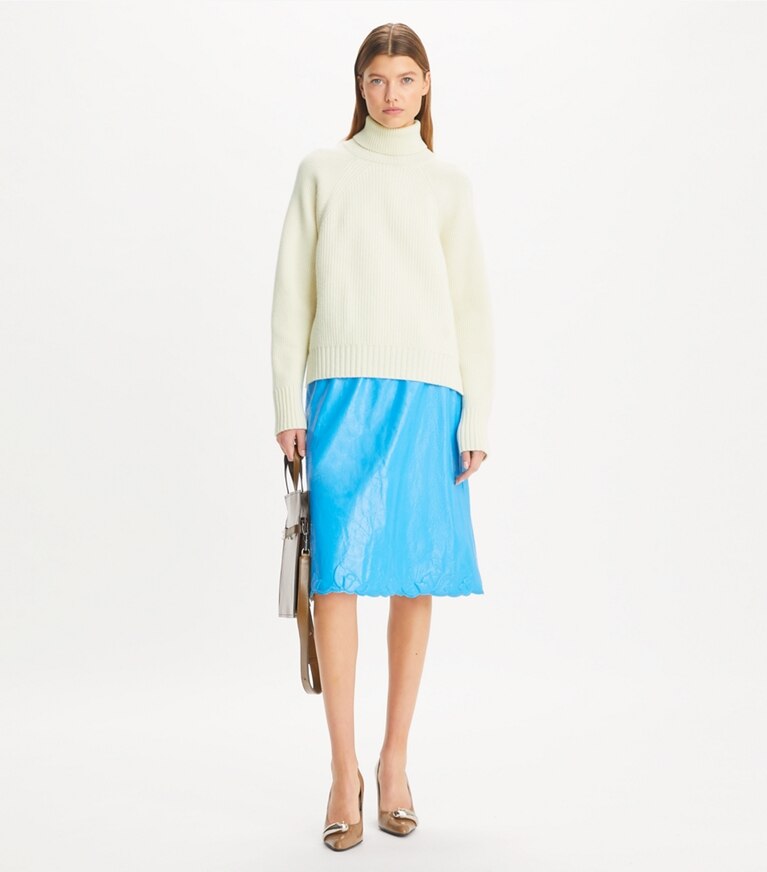 Tory Sport designer sweaters Wool Turtleneck Sweater in NEW IVORY on model front