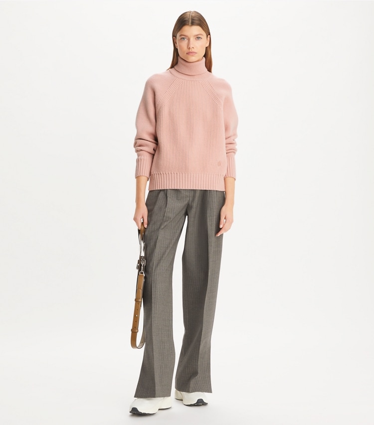 Tory Sport designer sweaters Wool Turtleneck Sweater in Dusk Pink on model front