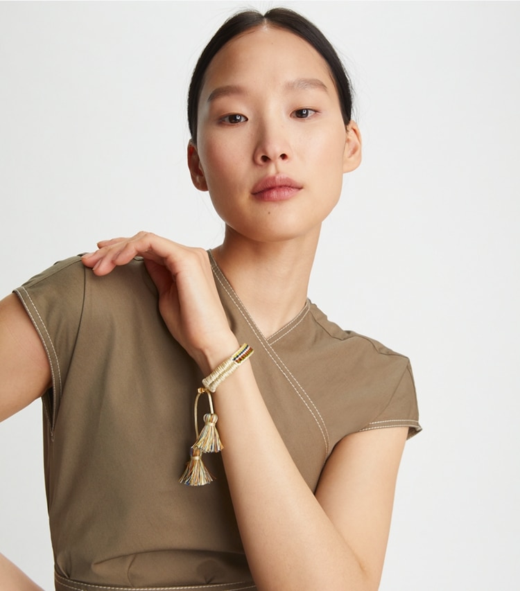 Tory Burch designer bracelets Woven Friendship Bracelet in Rolled Gold / Green Multi accessory on model