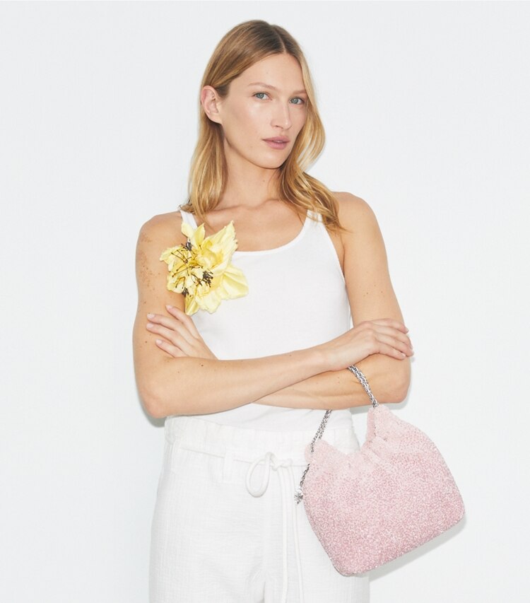 Tory Burch designer crossbody bags x BonBon Mini Fleming Hobo Bag mit Verzierung in Sugared Pink Raspberry additional on model