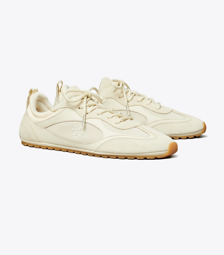 Tory Burch diseñador zapatillas Zapatilla Field en LIGHT CREAM ángulo