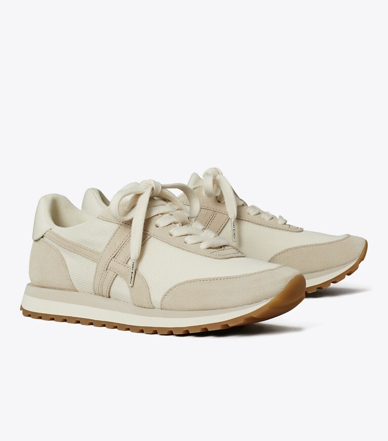 Tory Burch diseñador zapatillas Zapatilla Hank en NEW IVORY / CALCARE / TITANIUM WHITE ángulo