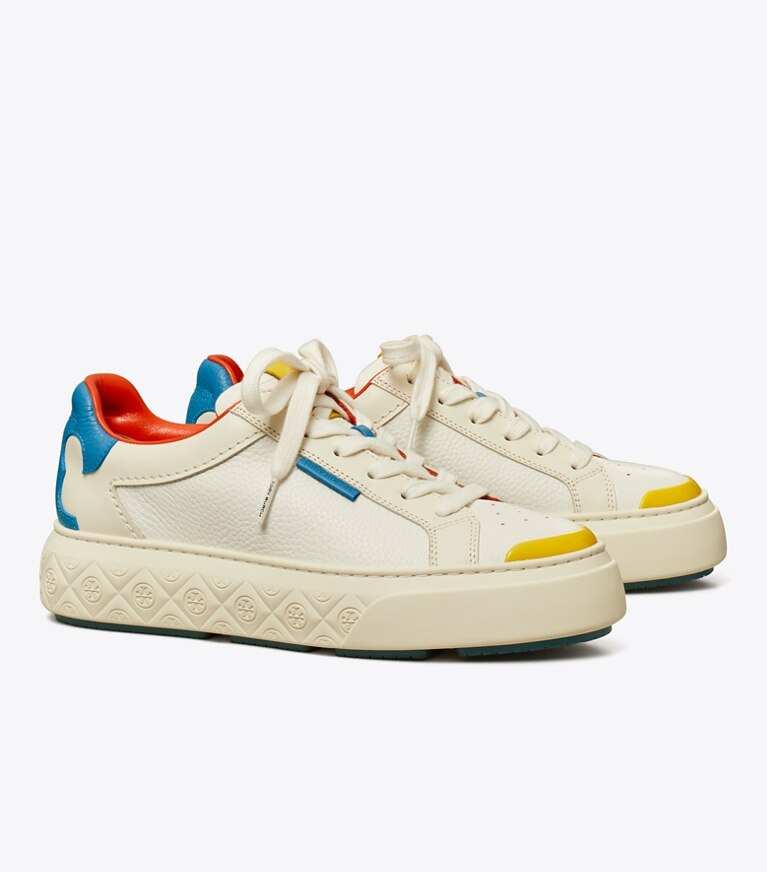 Tory Burch diseñador zapatillas Zapatillas Ladybug en WHITE / NEW IVORY / COBALT ángulo