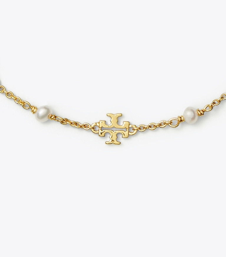 Tory Burch designer armbänder Zartes Kira Gliederarmband mit Perlen in Tory Gold / Pearl front