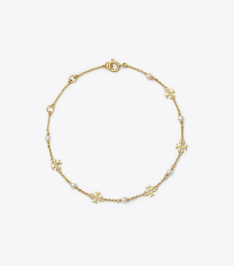Tory Burch designer armbänder Zartes Kira Gliederarmband mit Perlen in Tory Gold / Pearl front